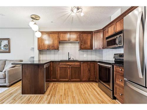 323-345 Rocky Vista Park Nw, Calgary, AB - Indoor Photo Showing Kitchen With Stainless Steel Kitchen