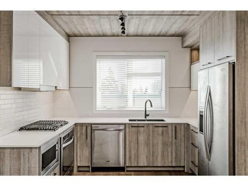 310-2702 17 Avenue Sw, Calgary, AB - Indoor Photo Showing Kitchen With Stainless Steel Kitchen With Double Sink With Upgraded Kitchen