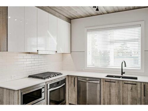 310-2702 17 Avenue Sw, Calgary, AB - Indoor Photo Showing Kitchen With Stainless Steel Kitchen With Double Sink With Upgraded Kitchen