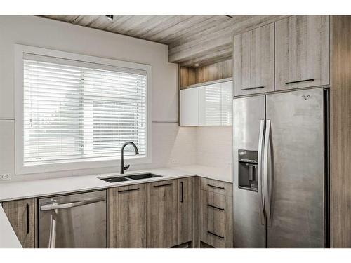 310-2702 17 Avenue Sw, Calgary, AB - Indoor Photo Showing Kitchen With Stainless Steel Kitchen With Double Sink With Upgraded Kitchen