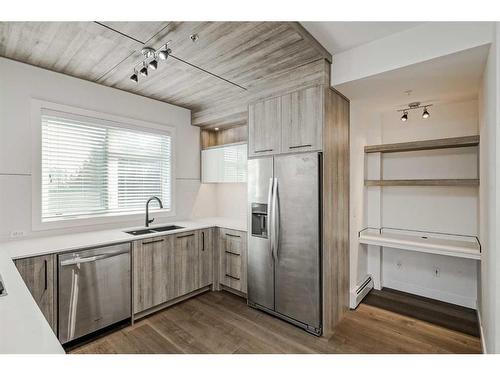 310-2702 17 Avenue Sw, Calgary, AB - Indoor Photo Showing Kitchen With Stainless Steel Kitchen With Double Sink With Upgraded Kitchen