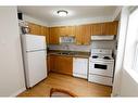 3-713 Mcdougall Road Ne, Calgary, AB  - Indoor Photo Showing Kitchen With Double Sink 