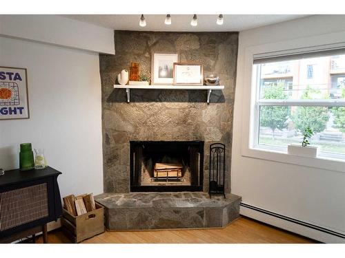 3-713 Mcdougall Road Ne, Calgary, AB - Indoor Photo Showing Other Room With Fireplace