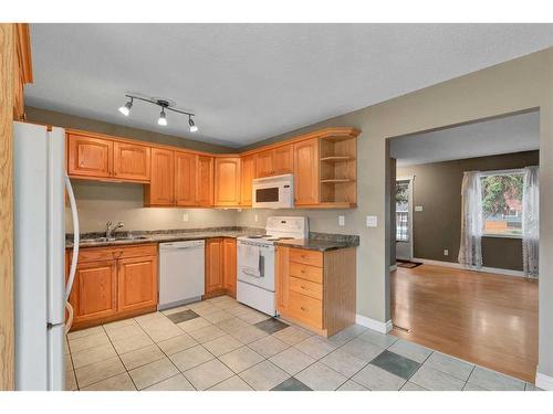 2442 Elmwood Drive Se, Calgary, AB - Indoor Photo Showing Kitchen With Double Sink