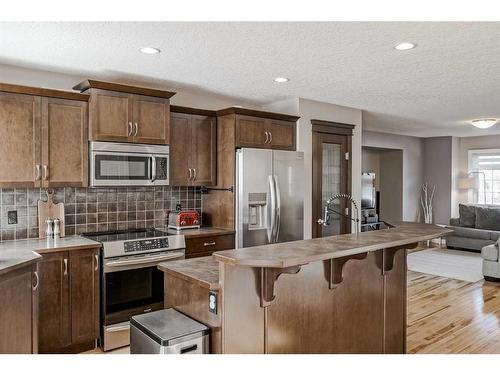 2486 Ravenswood View Se, Airdrie, AB - Indoor Photo Showing Kitchen With Upgraded Kitchen