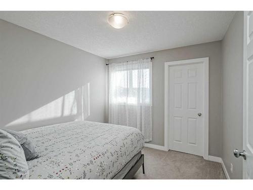 2486 Ravenswood View Se, Airdrie, AB - Indoor Photo Showing Bedroom