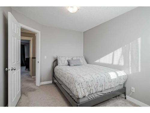 2486 Ravenswood View Se, Airdrie, AB - Indoor Photo Showing Bedroom