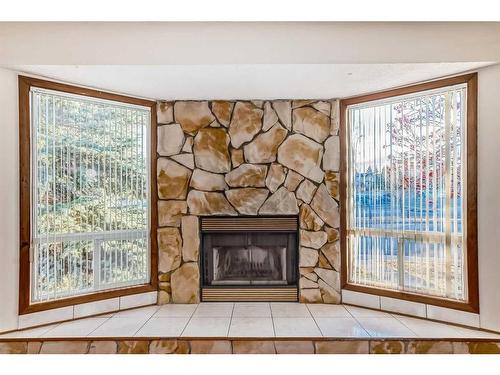 231 Shawglen Road Sw, Calgary, AB - Indoor Photo Showing Other Room With Fireplace