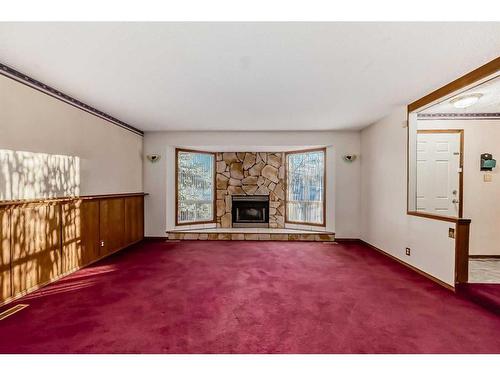 231 Shawglen Road Sw, Calgary, AB - Indoor Photo Showing Living Room With Fireplace