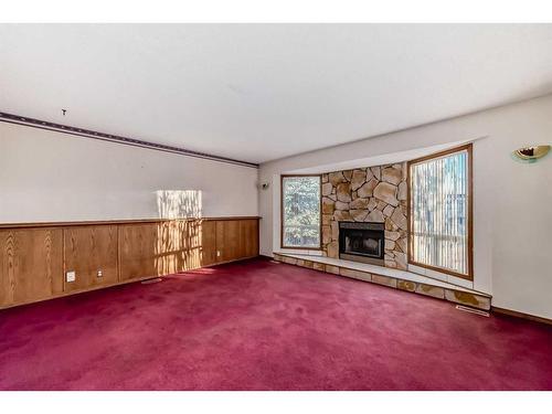 231 Shawglen Road Sw, Calgary, AB - Indoor Photo Showing Living Room With Fireplace