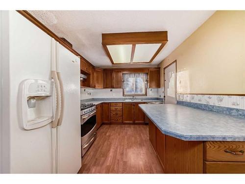 231 Shawglen Road Sw, Calgary, AB - Indoor Photo Showing Kitchen With Double Sink