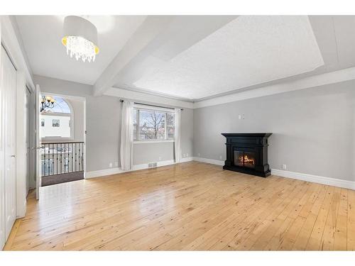 2131 Westmount Road Nw, Calgary, AB - Indoor Photo Showing Living Room With Fireplace