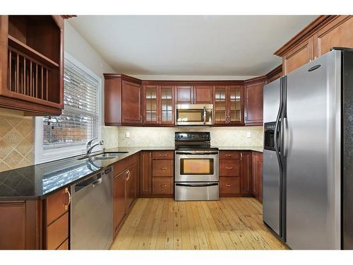 2131 Westmount Road Nw, Calgary, AB - Indoor Photo Showing Kitchen With Stainless Steel Kitchen With Double Sink