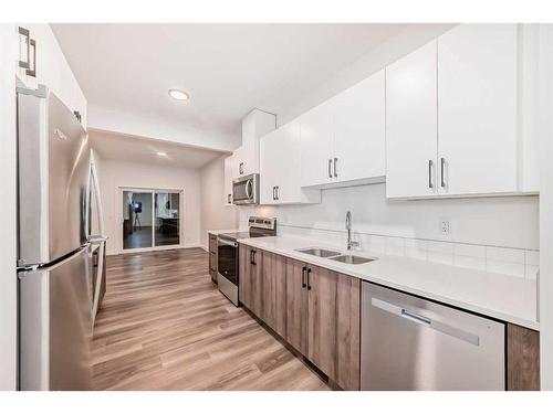 76 Tuscany Summit Square Nw, Calgary, AB - Indoor Photo Showing Kitchen With Stainless Steel Kitchen With Double Sink