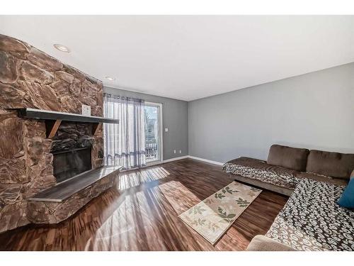 7006B Bowness Road Nw, Calgary, AB - Indoor Photo Showing Living Room With Fireplace