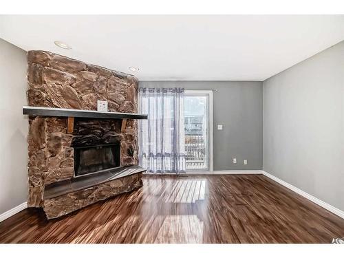 7006B Bowness Road Nw, Calgary, AB - Indoor Photo Showing Living Room With Fireplace