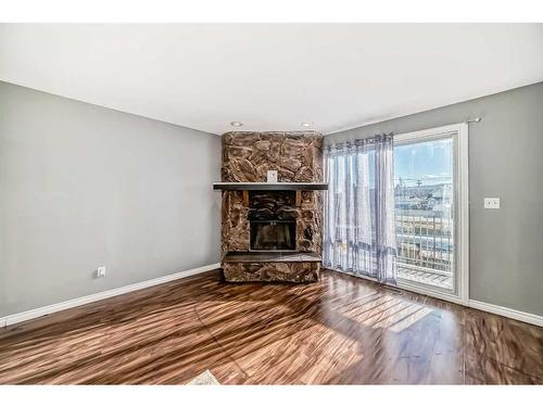 7006B Bowness Road Nw, Calgary, AB - Indoor Photo Showing Living Room With Fireplace