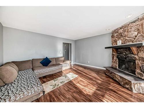 7006B Bowness Road Nw, Calgary, AB - Indoor Photo Showing Living Room With Fireplace