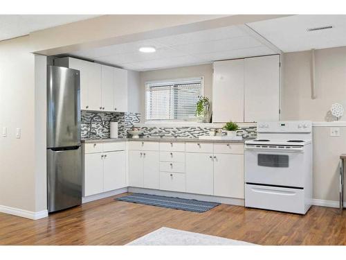 1216 Allen Street Se, Airdrie, AB - Indoor Photo Showing Kitchen With Double Sink