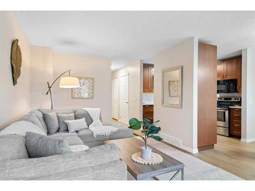 1216 Allen Street Se, Airdrie, AB - Indoor Photo Showing Living Room