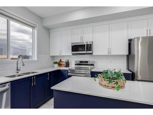 152 Edith Place Nw, Calgary, AB - Indoor Photo Showing Kitchen With Stainless Steel Kitchen With Double Sink With Upgraded Kitchen