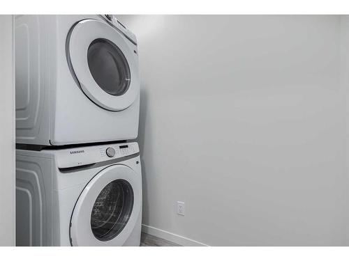 152 Edith Place Nw, Calgary, AB - Indoor Photo Showing Laundry Room