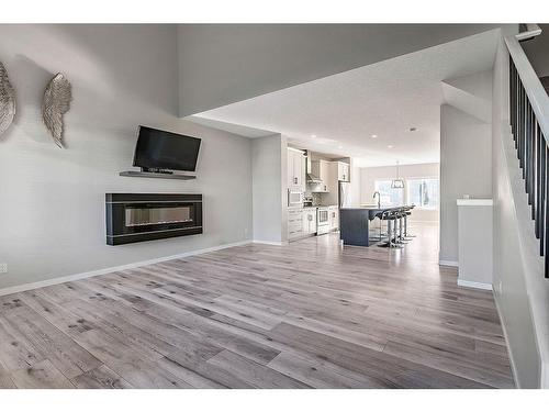 532 Belmont Heath Sw, Calgary, AB - Indoor Photo Showing Living Room With Fireplace