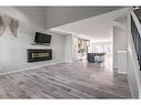 532 Belmont Heath Sw, Calgary, AB  - Indoor Photo Showing Living Room With Fireplace 