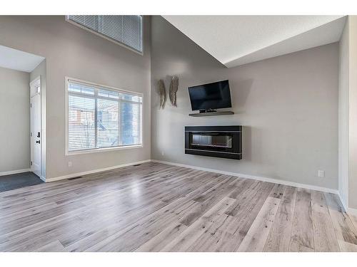 532 Belmont Heath Sw, Calgary, AB - Indoor Photo Showing Living Room With Fireplace