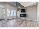 532 Belmont Heath Sw, Calgary, AB  - Indoor Photo Showing Living Room With Fireplace 