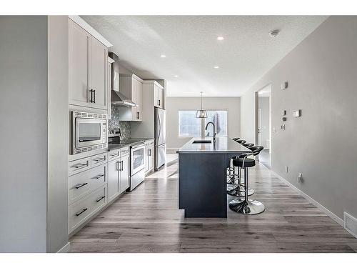 532 Belmont Heath Sw, Calgary, AB - Indoor Photo Showing Kitchen With Upgraded Kitchen