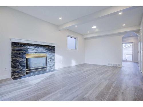 3847 Catalina Boulevard Ne, Calgary, AB - Indoor Photo Showing Living Room With Fireplace