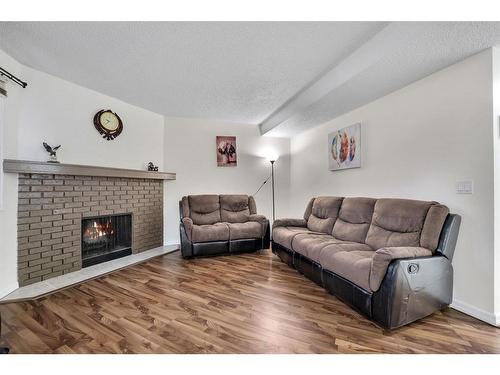 189 Templehill Drive Ne, Calgary, AB - Indoor Photo Showing Living Room With Fireplace