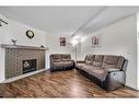 189 Templehill Drive Ne, Calgary, AB  - Indoor Photo Showing Living Room With Fireplace 