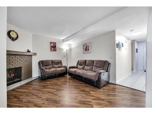 189 Templehill Drive Ne, Calgary, AB - Indoor Photo Showing Living Room With Fireplace