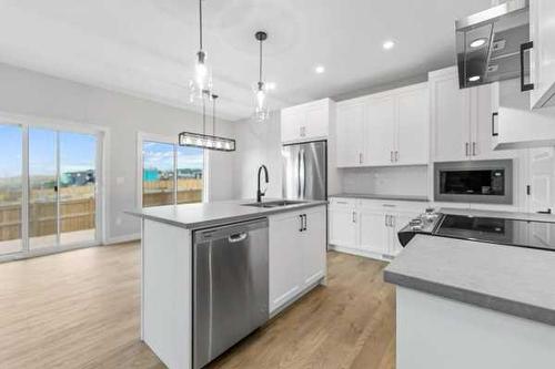 23 Key Cove, Airdrie, AB - Indoor Photo Showing Kitchen With Upgraded Kitchen