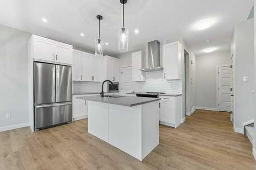 23 Key Cove, Airdrie, AB - Indoor Photo Showing Kitchen With Upgraded Kitchen