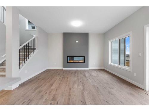 23 Key Cove, Airdrie, AB - Indoor With Fireplace