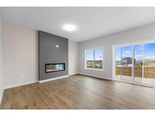 23 Key Cove, Airdrie, AB - Indoor Photo Showing Living Room With Fireplace