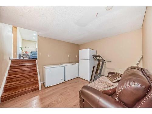 16 Madigan Court Ne, Calgary, AB - Indoor Photo Showing Gym Room