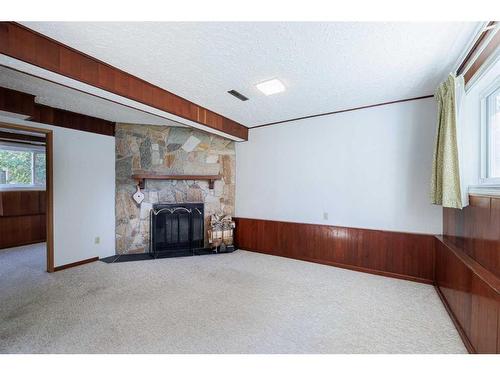 14 Glacier Place Sw, Calgary, AB - Indoor With Fireplace