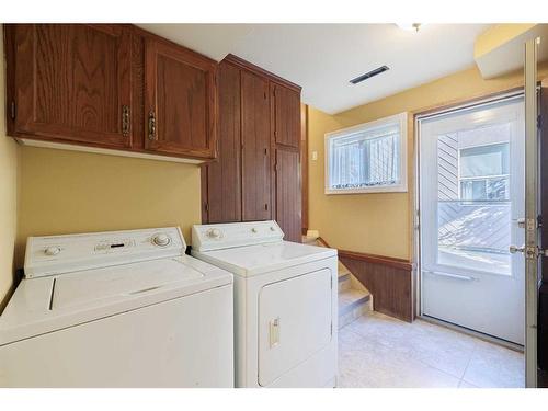 14 Glacier Place Sw, Calgary, AB - Indoor Photo Showing Laundry Room