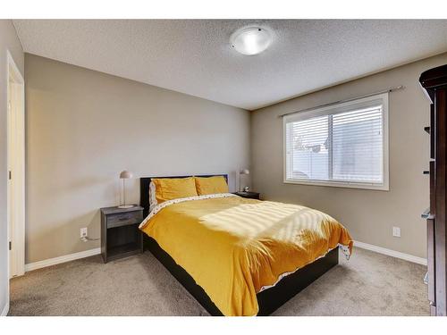 1587 Windstone Road Sw, Airdrie, AB - Indoor Photo Showing Bedroom