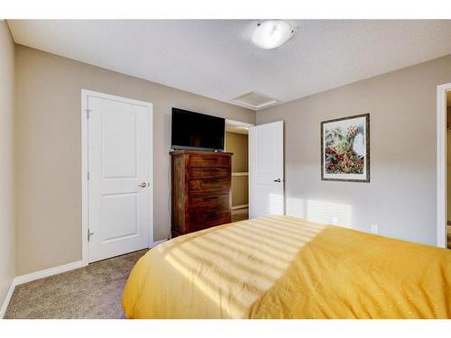 1587 Windstone Road Sw, Airdrie, AB - Indoor Photo Showing Bedroom