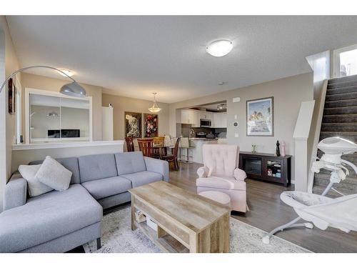 1587 Windstone Road Sw, Airdrie, AB - Indoor Photo Showing Living Room With Fireplace