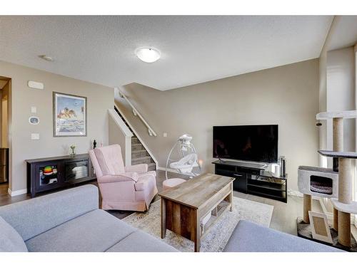 1587 Windstone Road Sw, Airdrie, AB - Indoor Photo Showing Living Room