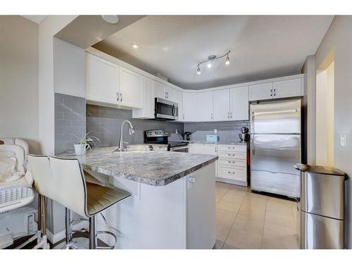 1587 Windstone Road Sw, Airdrie, AB - Indoor Photo Showing Kitchen With Stainless Steel Kitchen