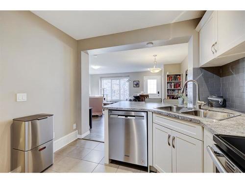 1587 Windstone Road Sw, Airdrie, AB - Indoor Photo Showing Kitchen With Stainless Steel Kitchen With Double Sink With Upgraded Kitchen