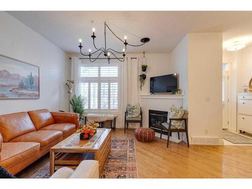 4-2001 34 Avenue Sw, Calgary, AB - Indoor Photo Showing Living Room With Fireplace