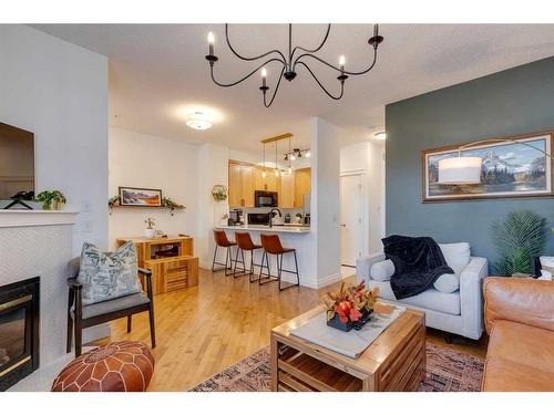 4-2001 34 Avenue Sw, Calgary, AB - Indoor Photo Showing Living Room With Fireplace